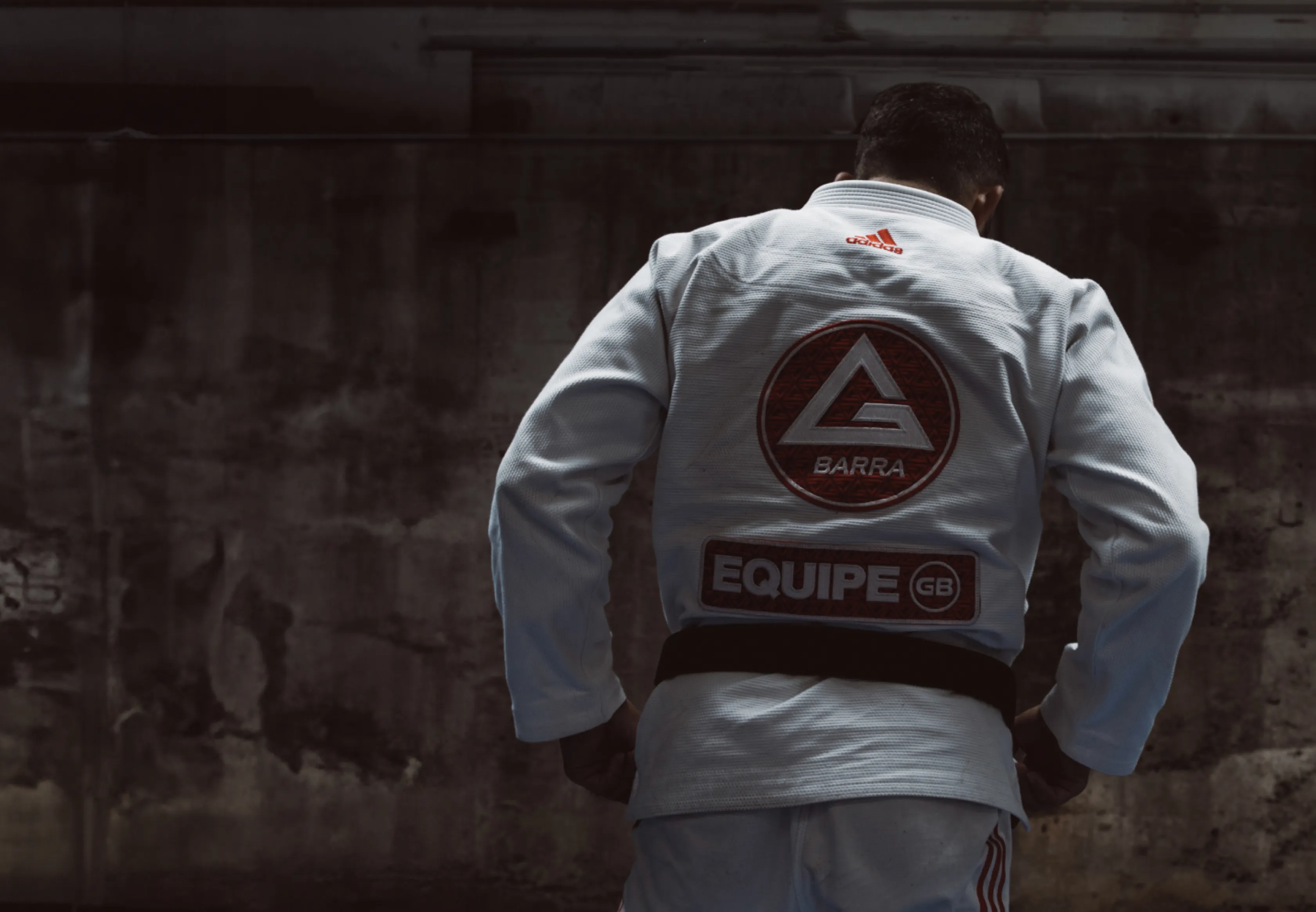 Jiu-jitsu practitioner in a white Gracie Barra gi